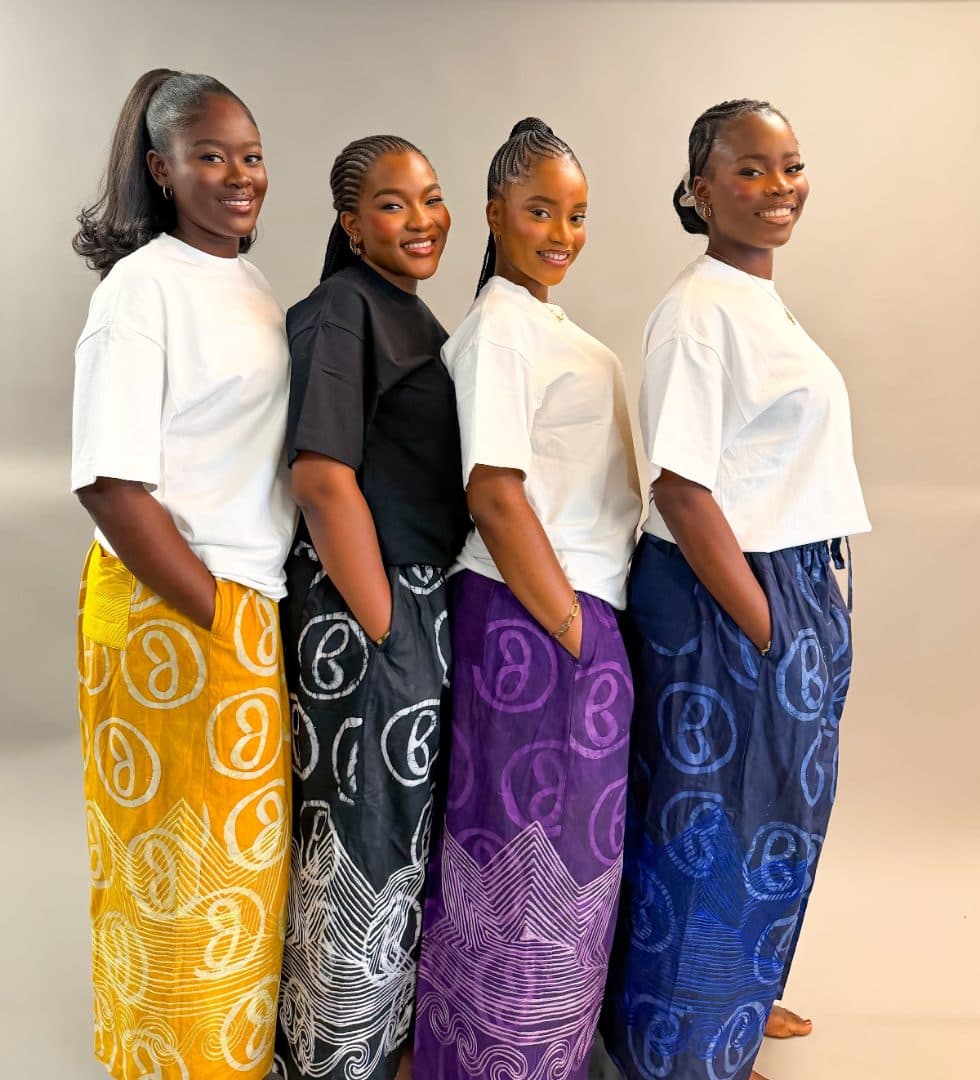 Four models wearing Jumbug tees with signature pants