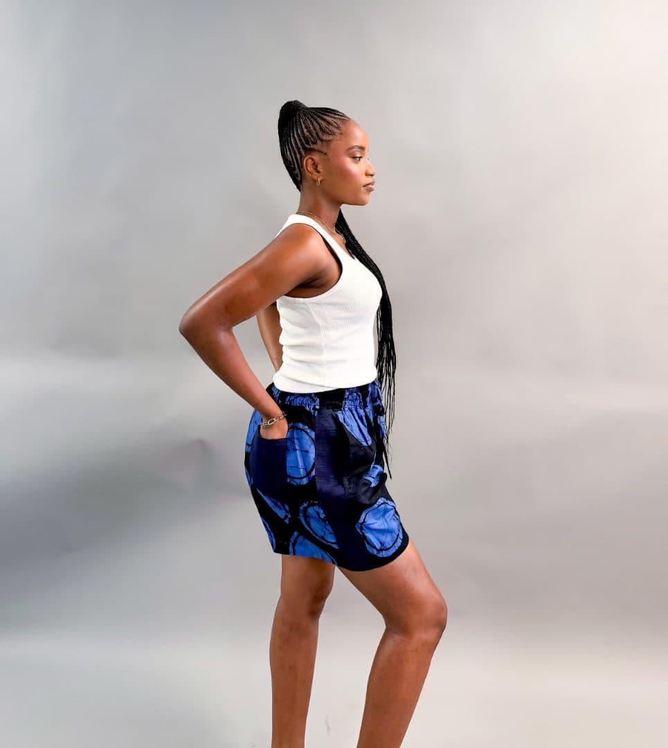 Model wearing the Adire Shorts in blue