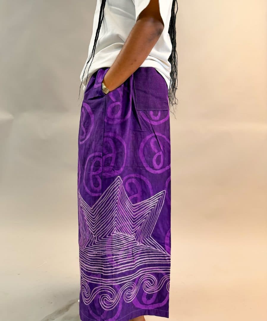 Model wearing the Jumbug Signature Pants (Unisex) in purple